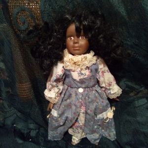 Vintage Porcelain doll with her outfit on